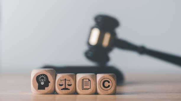 A wooden cube with a gavel on top of it, representing the importance of intellectual property rights in international trade.