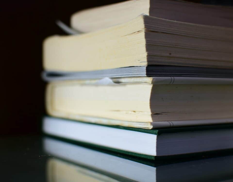 A stack of books on a table, fostering growth.