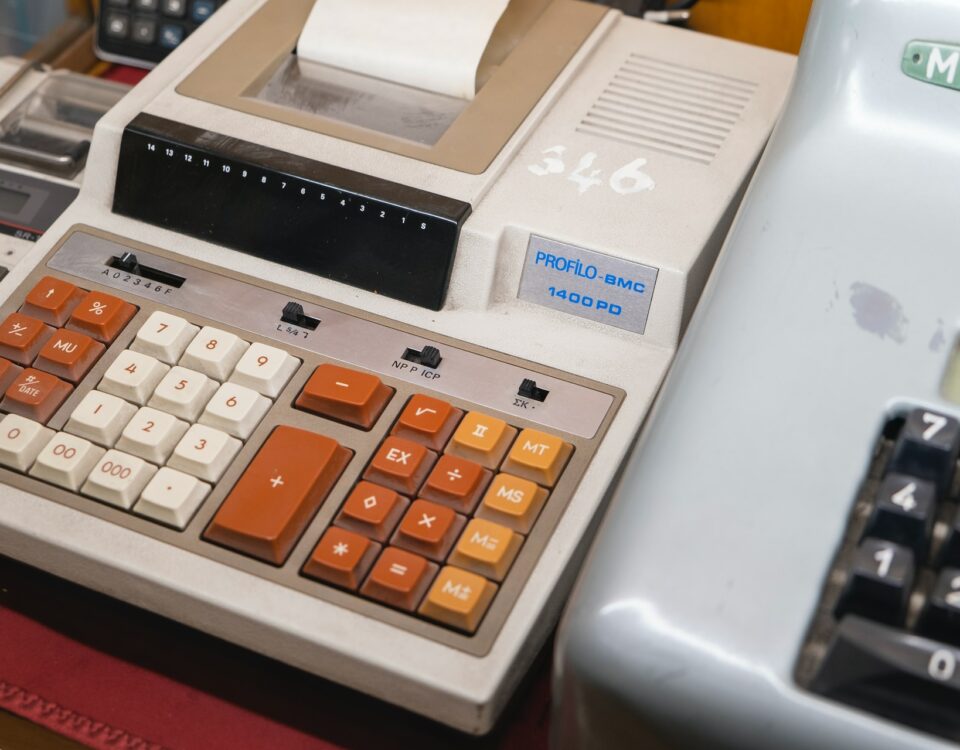 A cash register with a global pricing strategy, placed on a table.