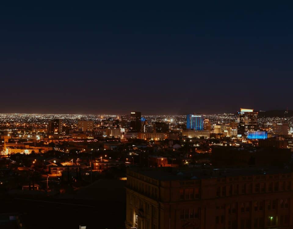 A global trade city skyline at night, filled with celebrate.