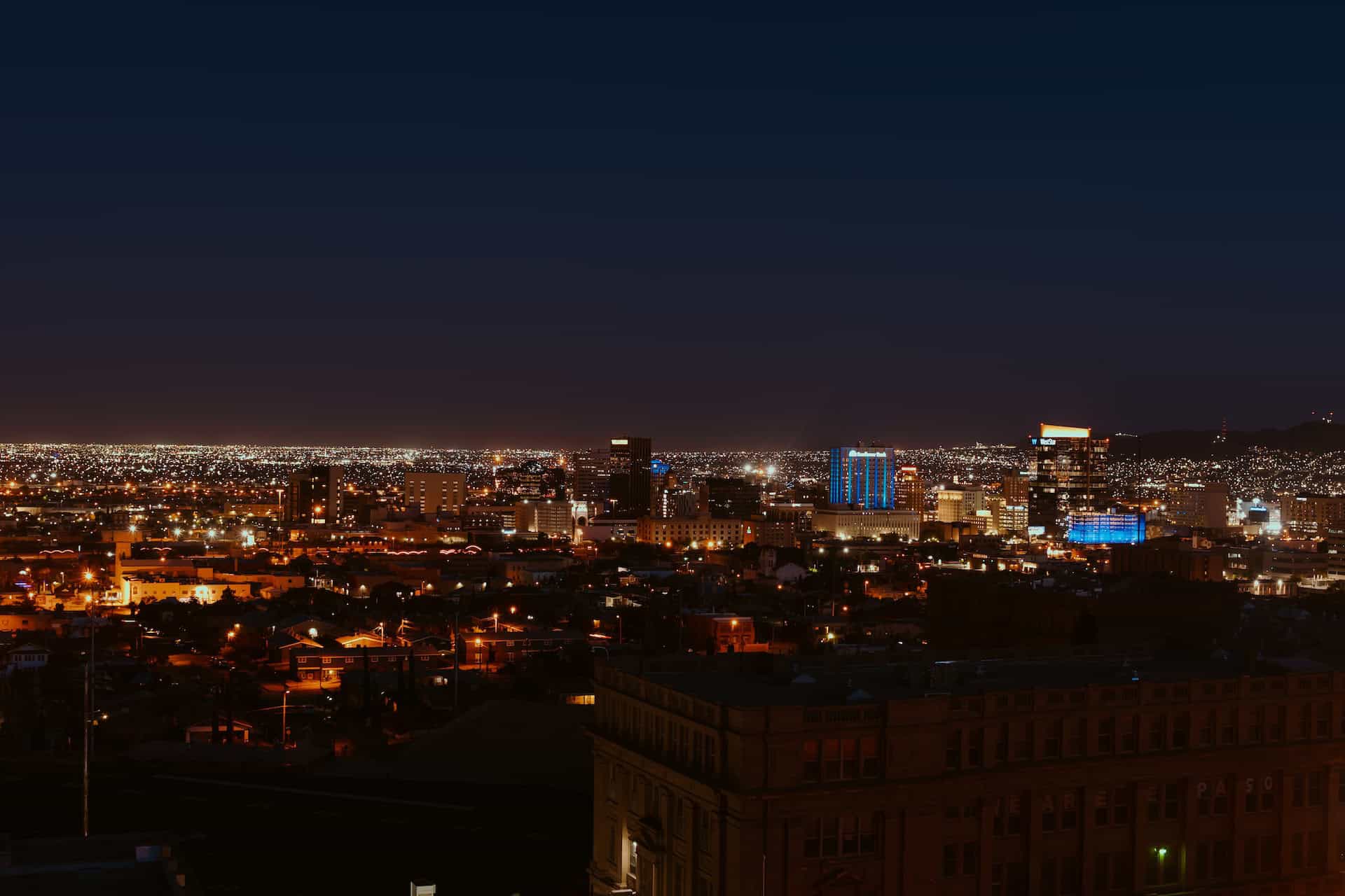 A global trade city skyline at night, filled with celebrate.