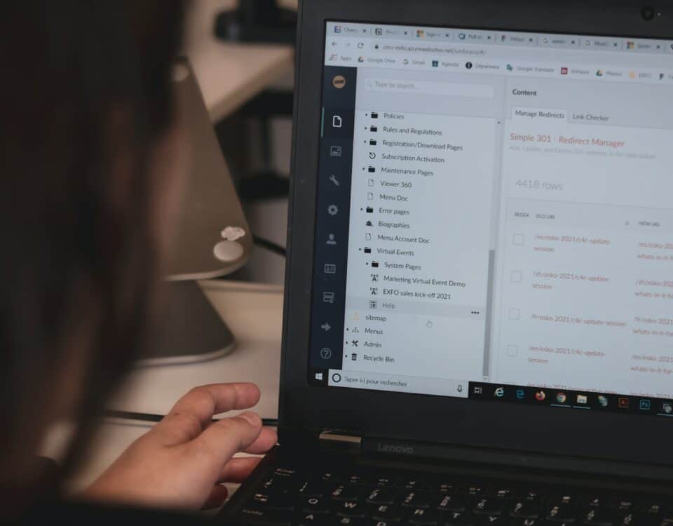 A woman is using a laptop for documentation purposes, utilizing the automation feature to export files seamlessly.