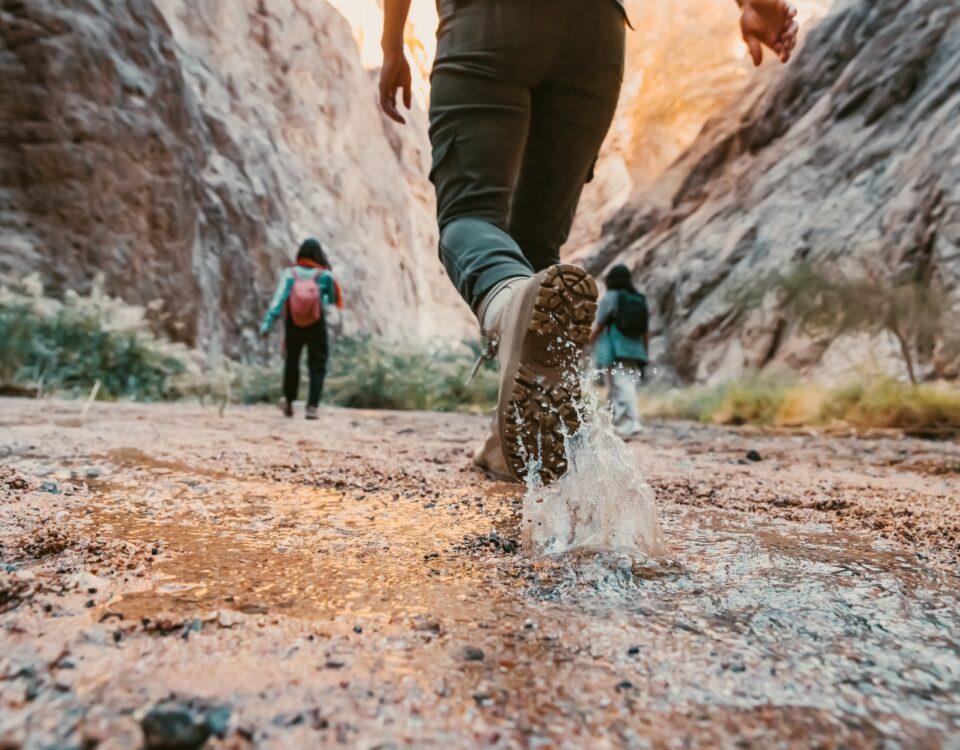 A group of hikers exploring a canyon.