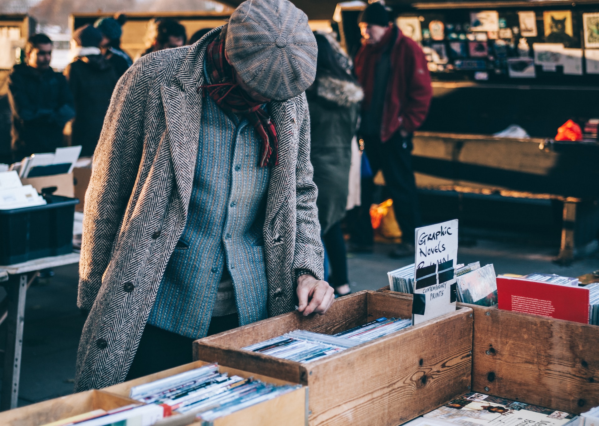 A man exploring records at a flea market, considering diversification strategies for the export market.