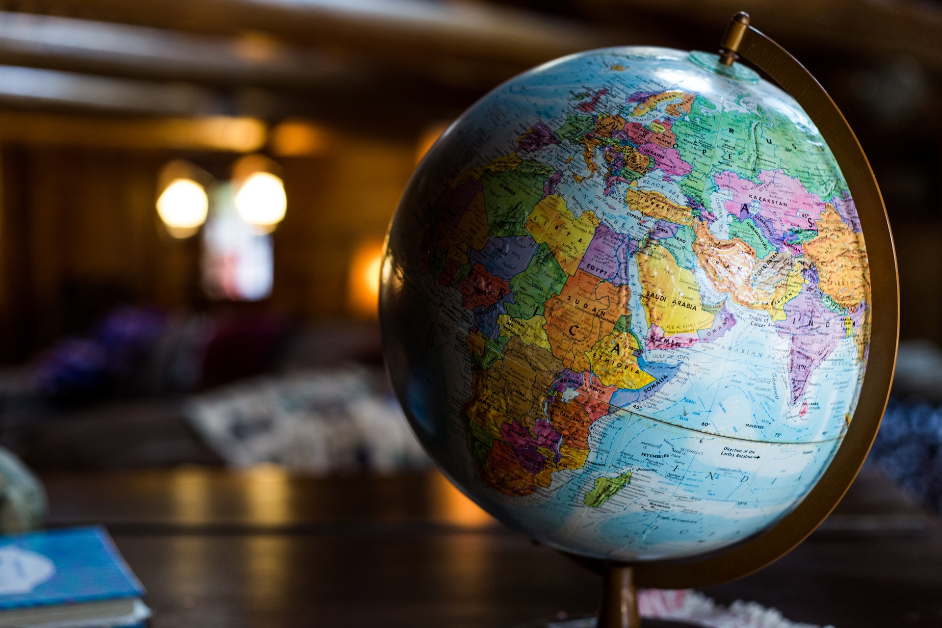 A globe sits on a table in a room, symbolizing the importance of understanding in promoting free trade.