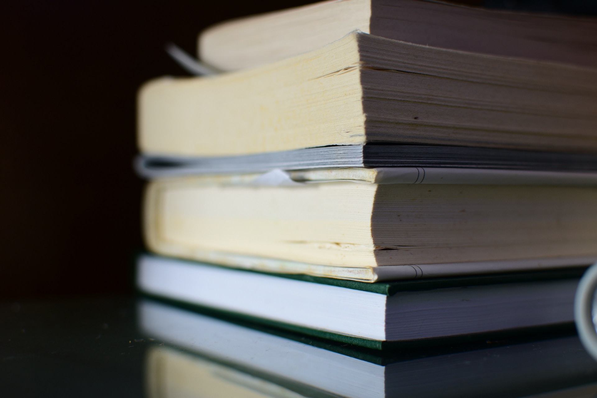 A stack of books on a table, fostering growth.