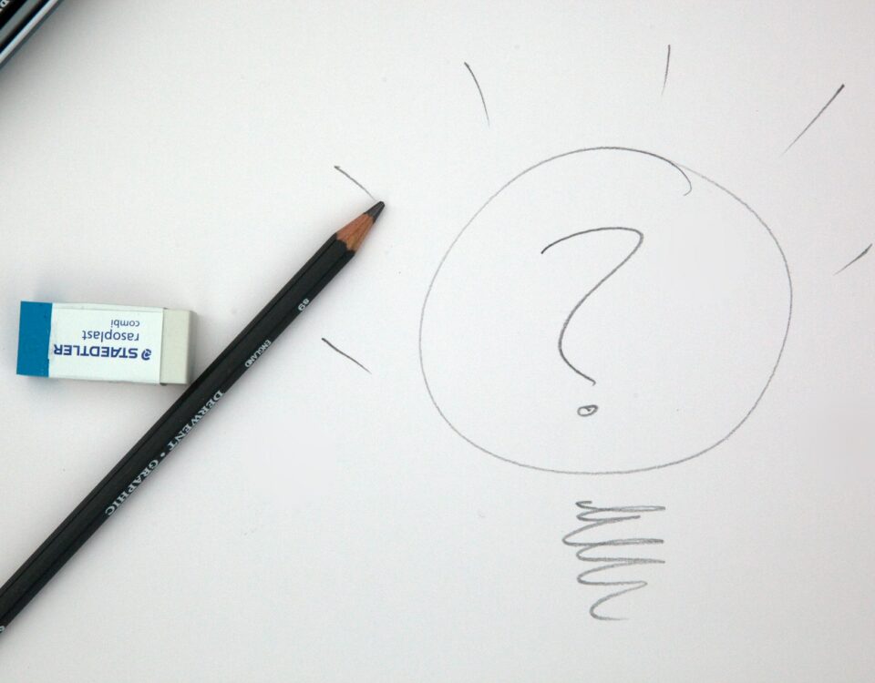 A sustainable light bulb with a question mark drawn on it.
