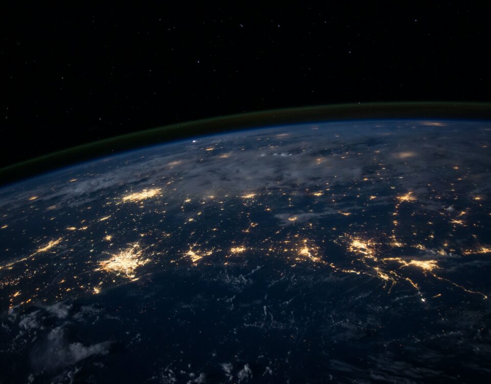 A mesmerizing view of the earth at night, showcasing its vibrant and illuminated cities.
